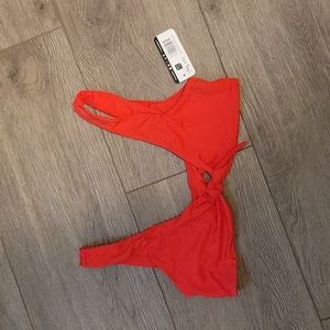 Dippin Daisy's cherry red front tie bikini top